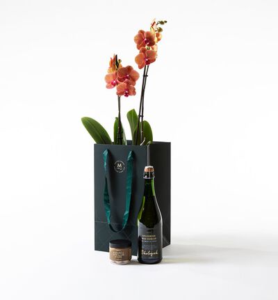 Gyllen orkidé i gavepose